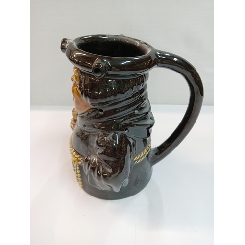 1266 - A Dartmouth pottery Black Friar gin Toby puzzle jug. Height 17cm