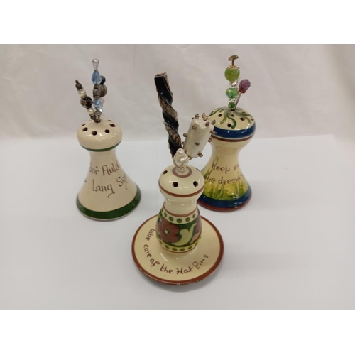 1275 - 6 Devon pottery Torquay ware hat pin stands