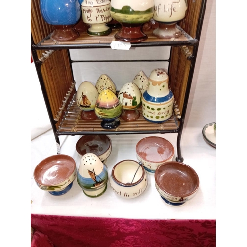 1298 - A large selection of Torquay ware cruets