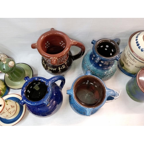 1300 - 4 puzzle jugs including C M Brannam Barum pottery