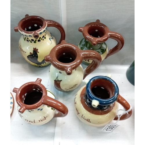 1303 - 5 small Torquay ware puzzle jugs