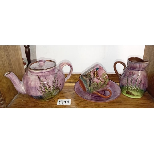 1314 - A selection of lilac glazed pottery