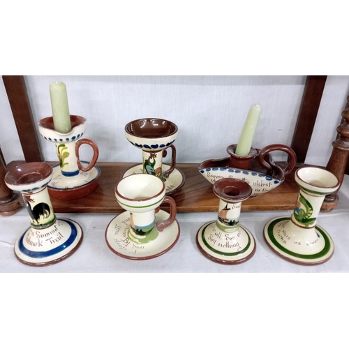 1324 - 11 Torquay ware candlesticks