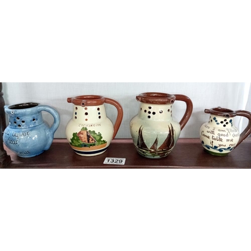 1329 - 8 Torquay ware mid size puzzle jugs