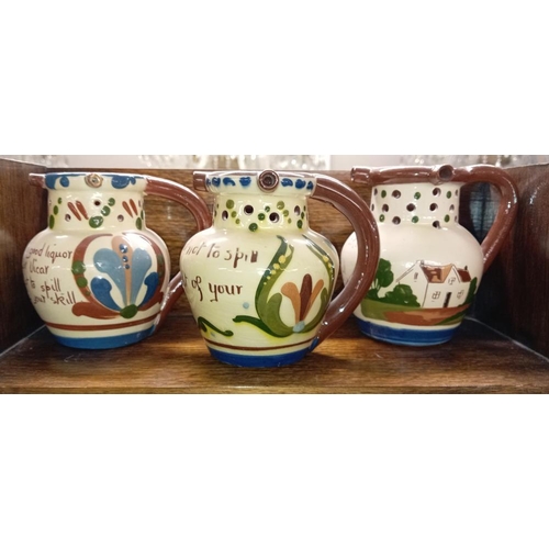 1331 - 6 Torquay ware mid size puzzle jugs