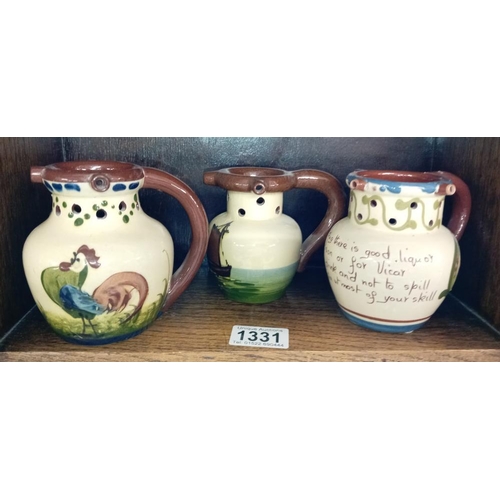 1331 - 6 Torquay ware mid size puzzle jugs