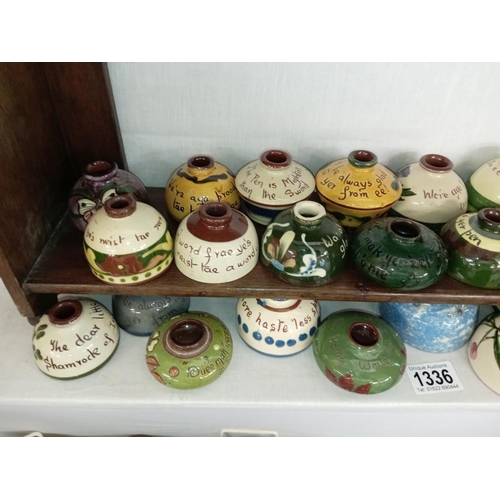 1336 - 25 Torquay ware inkwells, some with lids