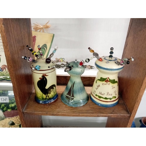 1339 - 6 Torquay ware hat pin stands