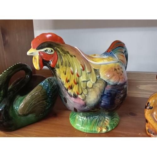 1197 - A Rooster RDNC 810176 teapot Circa 1930's, A swan planter & Pottery monkey