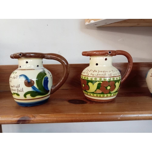 1198 - 4 Torquay pottery puzzle jugs