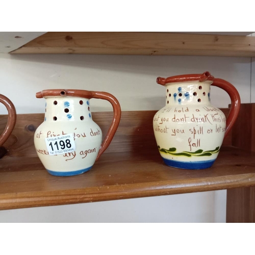 1198 - 4 Torquay pottery puzzle jugs