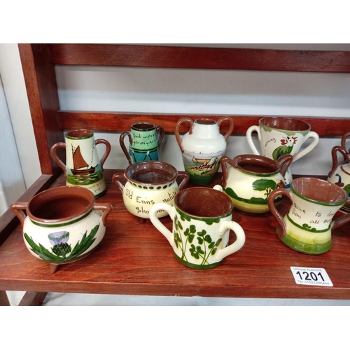 1201 - A good selection of Torquay pottery including Cauldrons, Loving cups & 2 handle vases