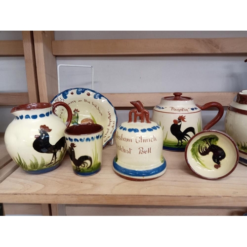 1214 - A good selection of chicken decorated pottery, 2 shelves