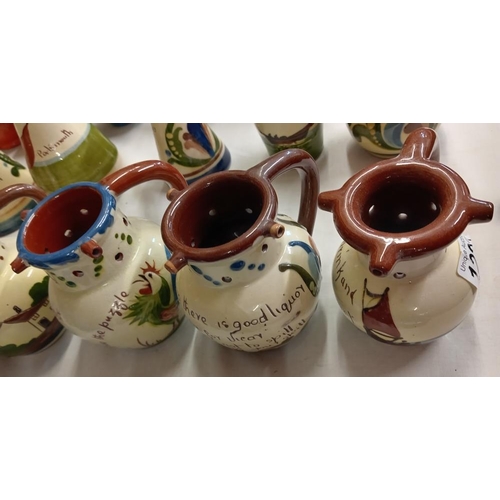 1222 - 6 Torquay ware puzzle jugs