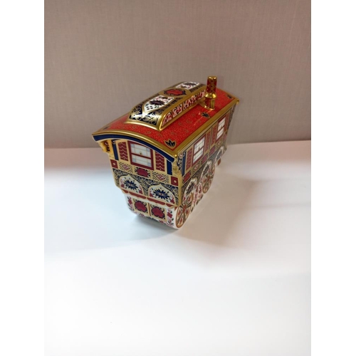 1354 - A Royal Crown Derby caravan with gold stopper