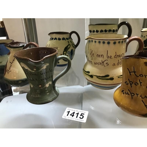 1415 - A collection of 10 Torquay ware & Motto ware jugs