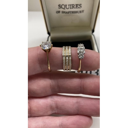 1039 - Three 9ct Gold rings. Total weight 8.04g with stones. 1x af