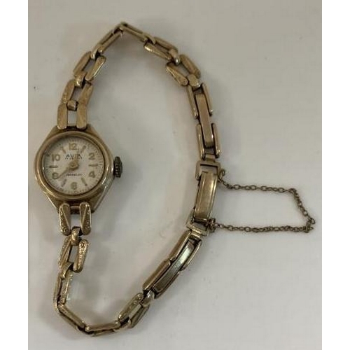 1040 - A 9ct Gold ladies Avia watch. Total weight 13.10g