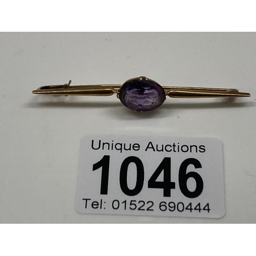 1046 - A15ct Gold Tie pin with Purple stone (total weight 4.45g)