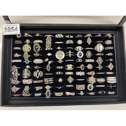 1054 - A Good tray of 100 silver & White metal rings . Tray Weight-125g. Ring Weight -373g. Total weight 49... 