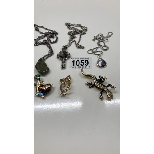 1059 - Three animal style broaches, including lizard. Three Scottish / Celtic style chains with pendants