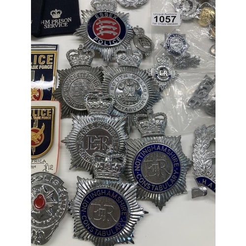 1057 - A good collection of British & Foreign helmet plates, badges, buttons etc.