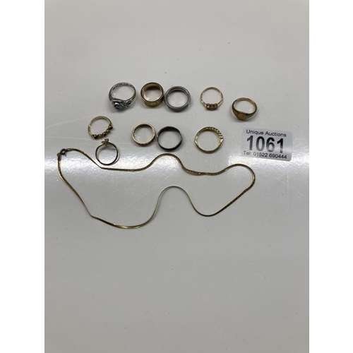 1061 - A 9ct gold necklace (1.74g) and a collection of Gold and Silver coloured rings.