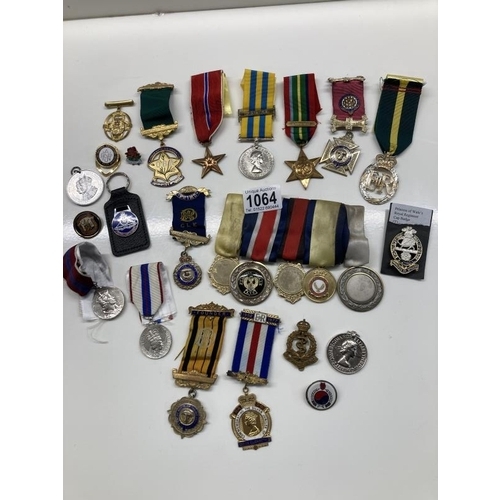 1064 - A mixed lot of 20th century medals etc.,