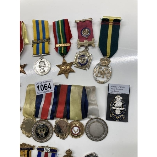 1064 - A mixed lot of 20th century medals etc.,