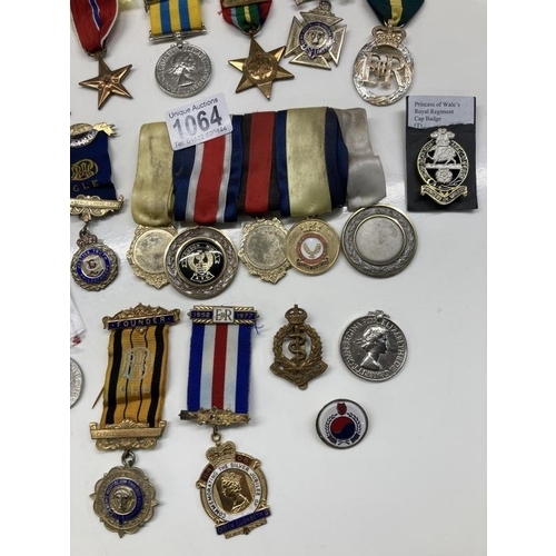 1064 - A mixed lot of 20th century medals etc.,