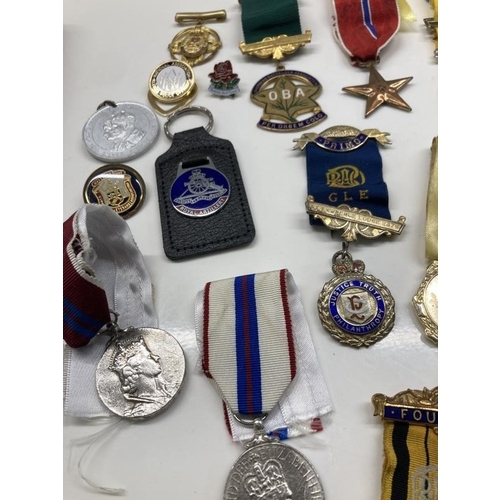 1064 - A mixed lot of 20th century medals etc.,