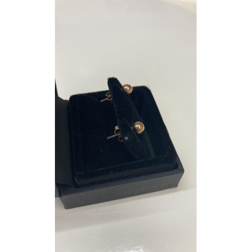 1074 - A pair of Rose Gold ear studs in 9ct gold