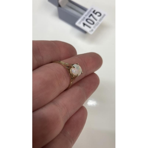 1075 - A vintage Rose Gold ring set with an oval opal size O stamped 9 ct