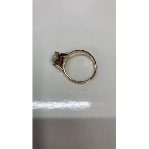 1075 - A vintage Rose Gold ring set with an oval opal size O stamped 9 ct