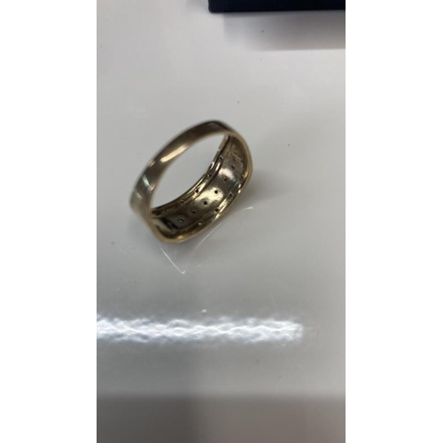 1080 - A Diamond three stone band ring in 9ct gold size Q