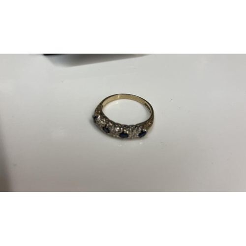 1081 - A Diamond and sapphire ring set in 9ct gold size K 1/2