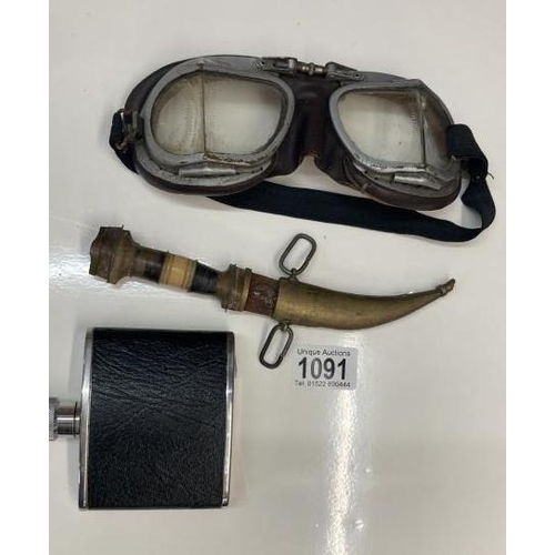 1091 - A pair of Antique goggles a leather whiskey flask and a knife