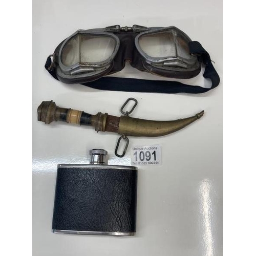 1091 - A pair of Antique goggles a leather whiskey flask and a knife