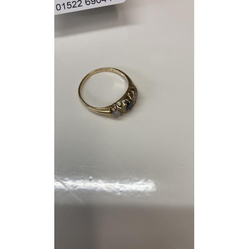 1096 - A gold ring set imitation opals, diamonds sapphire total weight 3.26g