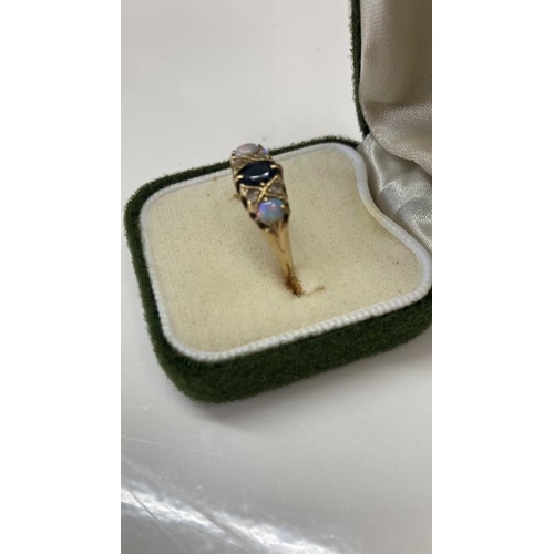 1096 - A gold ring set imitation opals, diamonds sapphire total weight 3.26g