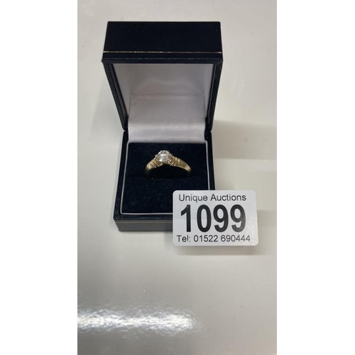 1099 - A 14ct gold ring with large solitaire imitation Diamond