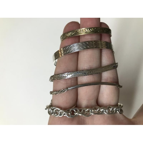 1100J - 6 items of silver including chains bangles etc