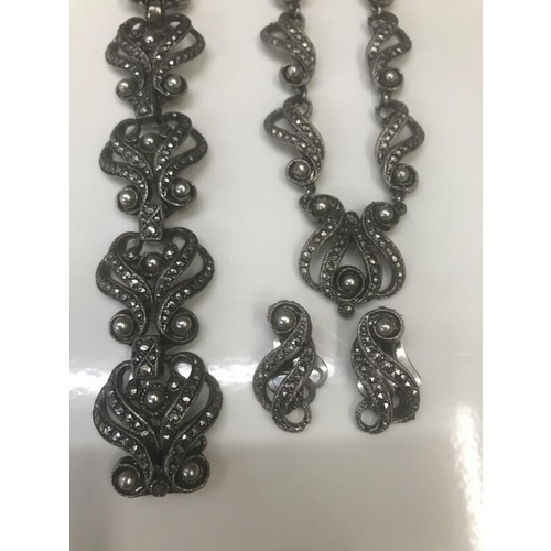 1072 - A cut steel necklace and matching bracelet and earrings