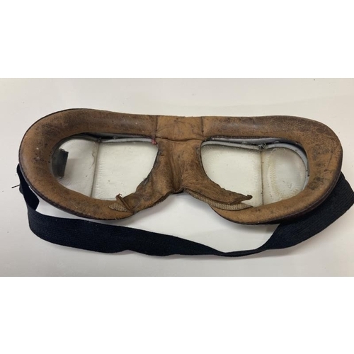 1091 - A pair of Antique goggles a leather whiskey flask and a knife