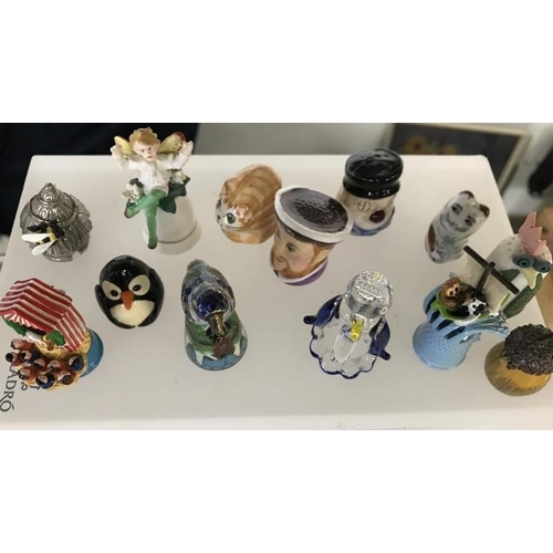 1136 - A Large collection of Thimbles under 4 domes, including Minton & Royal Crown Derby etc