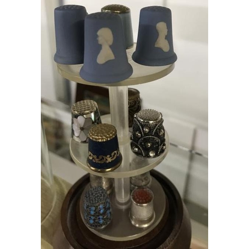 1136 - A Large collection of Thimbles under 4 domes, including Minton & Royal Crown Derby etc