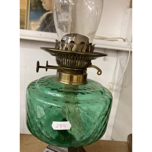 1137 - A Victorian oil lamp with green glass shade