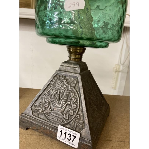 1137 - A Victorian oil lamp with green glass shade