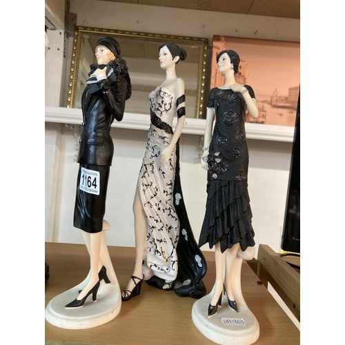 1164 - Four fashion lady figurines