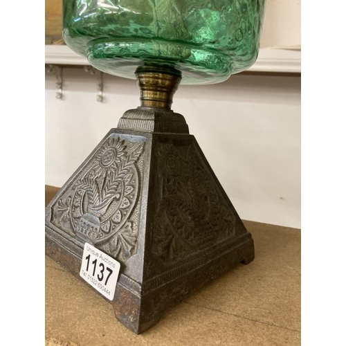 1137 - A Victorian oil lamp with green glass shade